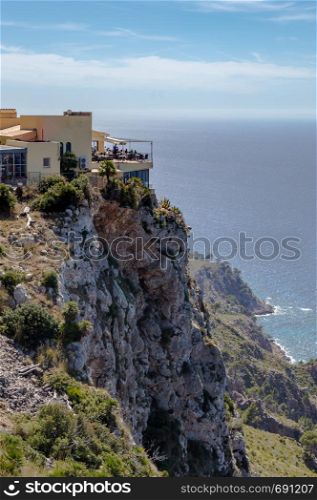 Terrace of a restaurant in Majorca built on a cliff overlooking the Mediterranean Sea. Terrace of a restaurant in Majorca