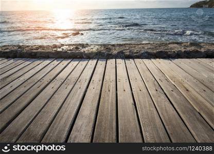 Terrace view sea with empty wooden table top on the beach landscape nature with sunset or sunrise / wooden board balcony view seascape idyllic seashore