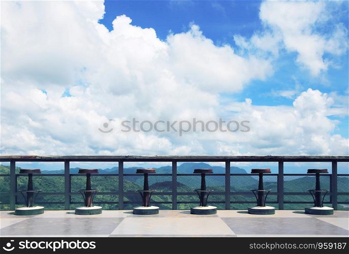 Terrace with beautiful view of the sky and mountains The atmosphere is fresh in nature , Chair in coffee shop at Khaokor thailand