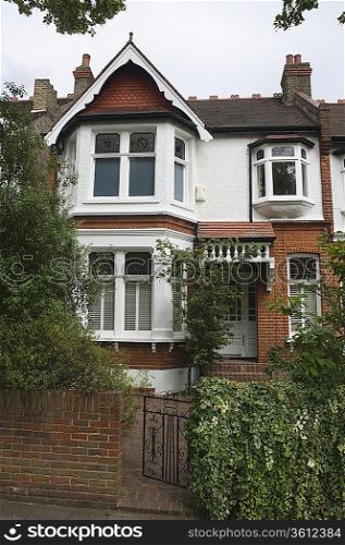 Terraced house with open front gate