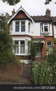 Terraced house with open front gate