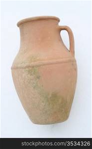 Terracotta amphora lying on a white background