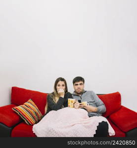 terrified couple watching movie
