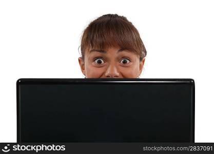 Terrified woman with a laptop