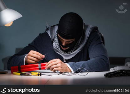 Terrorist bomber preparing dynamite bomb