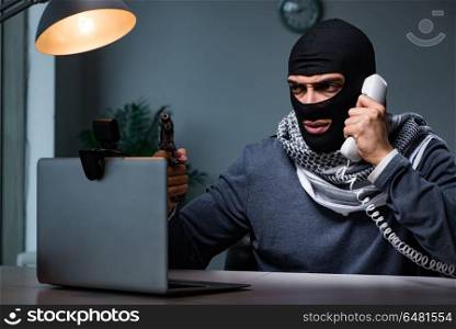 Terrorist wearing balaclava talking on phone