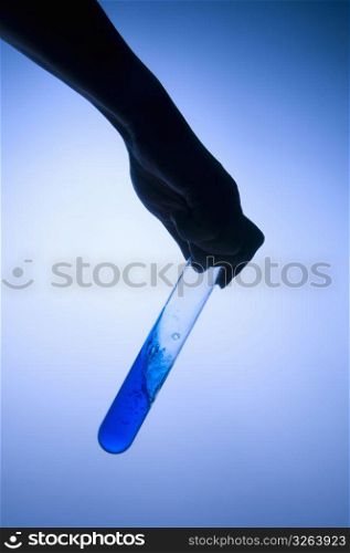 Test tube and hand