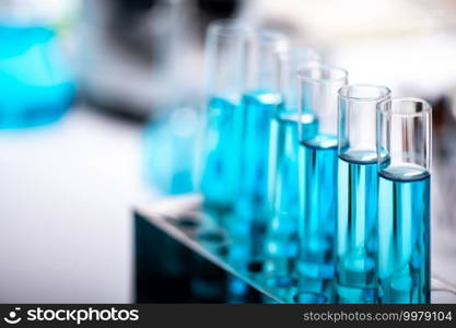 test-tube and laboratory glassware setting for science research, medical study, experiments for researching modern medical innovations, blue liquid s&le test