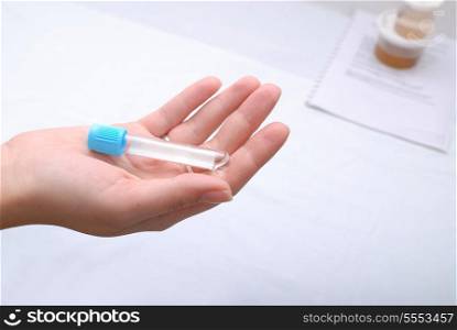 test tube in woman hand