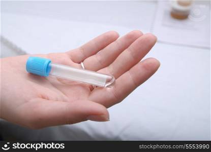 test tube in woman hand