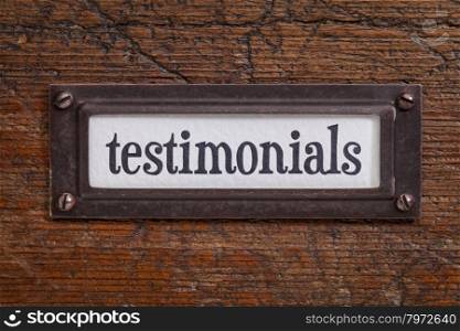 testimonials - a label on a grunge wooden file cabinet