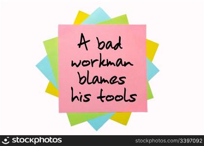 "text "A bad workman blames his tools" written by hand font on bunch of colored sticky notes"