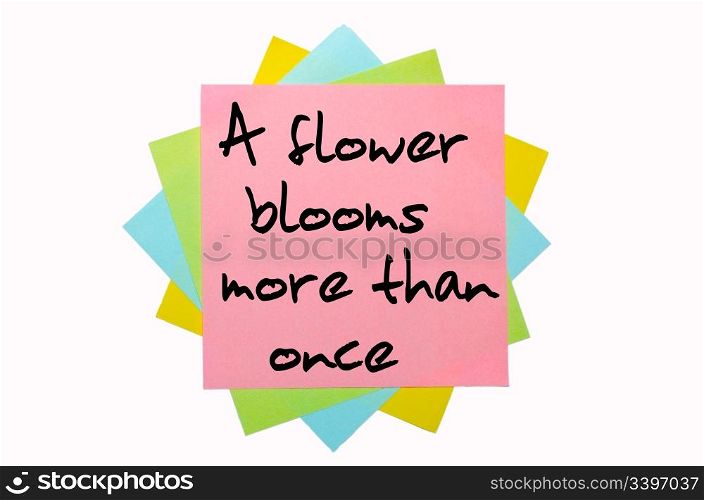 "text "A flower blooms more than once" written by hand font on bunch of colored sticky notes"