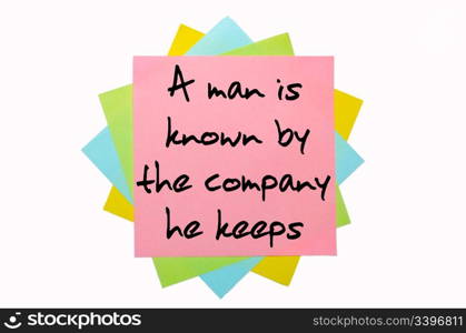 "text "A man is known by the company he keeps" written by hand font on bunch of colored sticky notes"