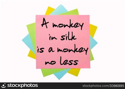 "text "A monkey in silk is a monkey no less" written by hand font on bunch of colored sticky notes"