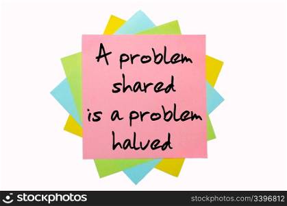 "text "A problem shared is a problem halved" written by hand font on bunch of colored sticky notes"