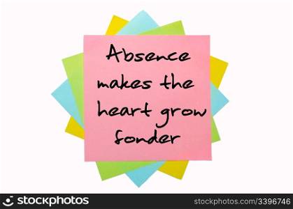 "text "Absence makes the heart grow fonder" written by hand font on bunch of colored sticky notes"