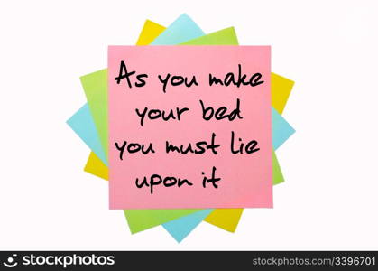 "text "As you make your bed you must lie upon it" written by hand font on bunch of colored sticky notes"