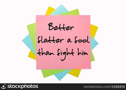 "text "Better flatter a fool than fight him" written by hand font on bunch of colored sticky notes"