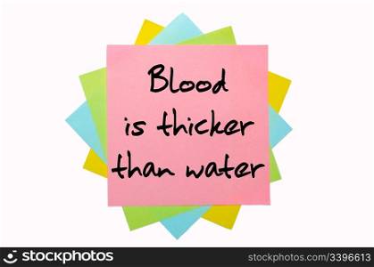 "text "Blood is thicker than water" written by hand font on bunch of colored sticky notes"