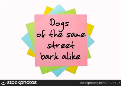 "text "Dogs of the same street bark alike" written by hand font on bunch of colored sticky notes"