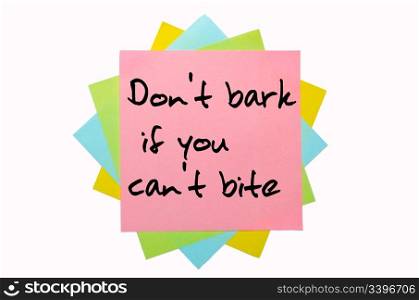 "text "Don&rsquo;t bark if you can&rsquo;t bite" written by hand font on bunch of colored sticky notes"