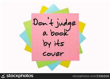 "text "Don&rsquo;t judge a book by its cover" written by hand font on bunch of colored sticky notes"