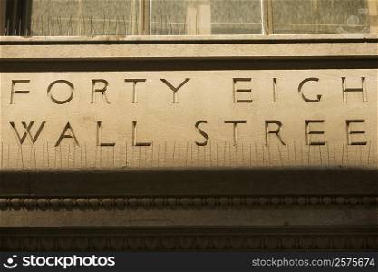 Text engraved on a wall, Wall Street, Manhattan, New York City, New York State, USA