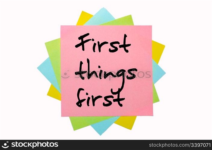 "text " First things first " written by hand font on bunch of colored sticky notes"