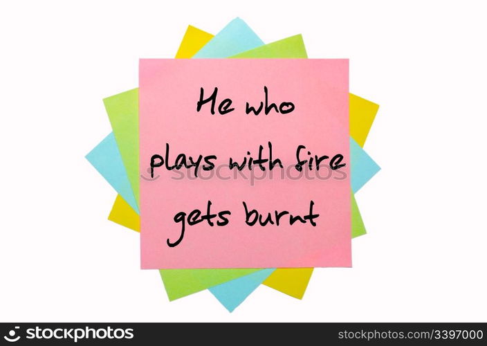 "text " He who plays with fire gets burnt " written by hand font on bunch of colored sticky notes"