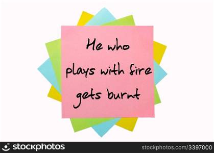 "text " He who plays with fire gets burnt " written by hand font on bunch of colored sticky notes"