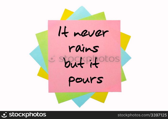 "text " It never rains but it pours " written by hand font on bunch of colored sticky notes"