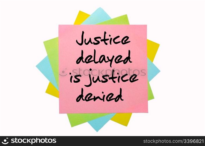 "text " Justice delayed is justice denied " written by hand font on bunch of colored sticky notes"