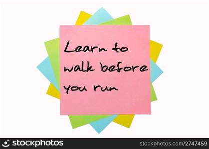"text "Learn to walk before you run" written by hand font on bunch of colored sticky notes"
