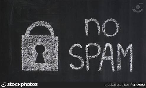 "Text "no spam" and padlock drawn on a blackboard"