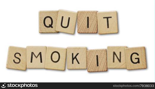 Text quit smoking.Scrabble pieces isolated on white