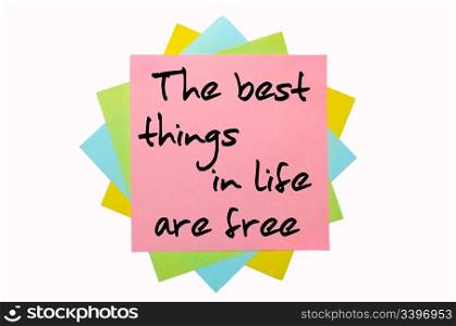 "text " The best things in life are free " written by hand font on bunch of colored sticky notes"