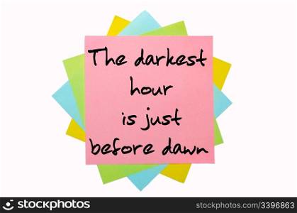 "text " The darkest hour is just before dawn " written by hand font on bunch of colored sticky notes"