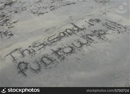 Text written in sand on beach, Shallow Bay, Gros Morne National Park, Newfoundland and Labrador, Canada