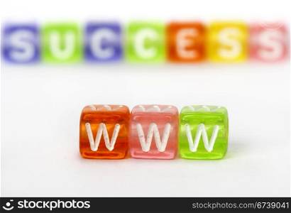 Text WWW and success on colorful cubes over white