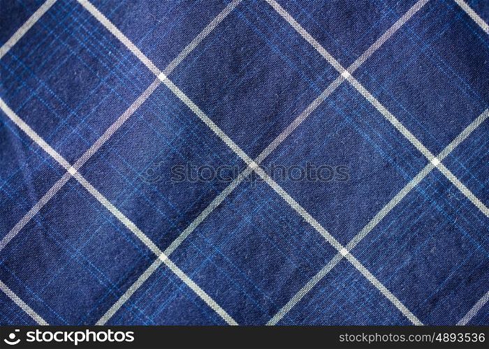 textile and texture concept - close up of checkered fabric background. close up of checkered textile or fabric background
