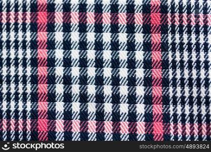 textile and texture concept - close up of checkered fabric background. close up of checkered textile or fabric background