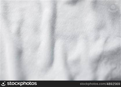 textile and texture concept - close up of cotton fabric background. close up of cotton textile or fabric background