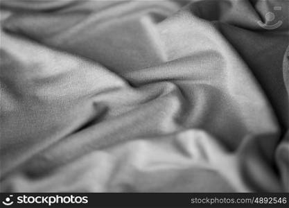 textile and texture concept - close up of crumpled gray cotton fabric background. close up of gray textile or fabric background
