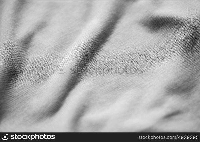 textile and texture concept - close up of gray cotton fabric background. close up of gray textile or fabric background