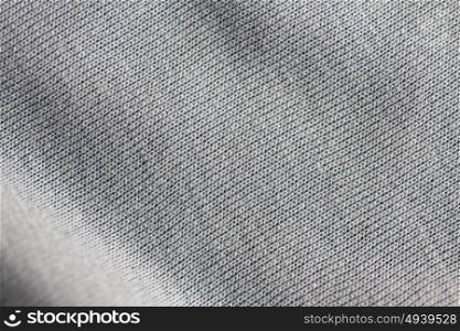 textile and texture concept - close up of gray cotton fabric background. close up of gray textile or fabric background