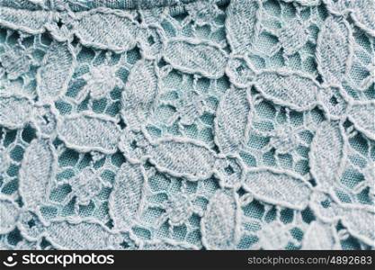 textile and texture concept - close up of lace fabric background. close up of lace textile or fabric background