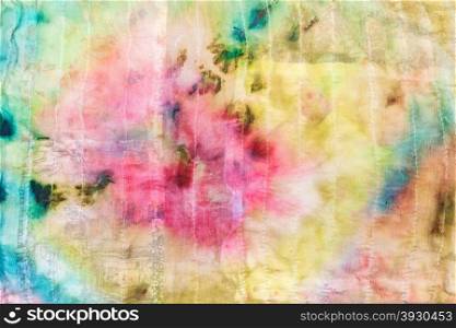 textile background from abstract floral pattern on stitched silk batik