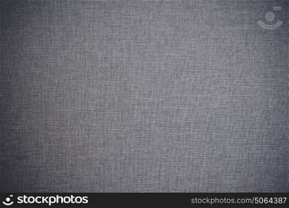 Textile background in grey color in wool fabric with classic fiber texture
