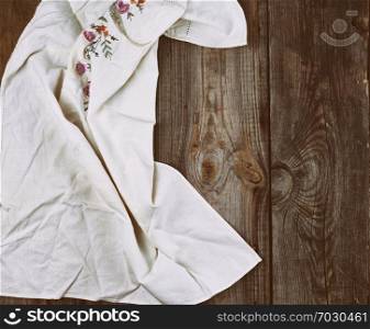 textile dishcloth on a gray wooden background from old boards, copy space